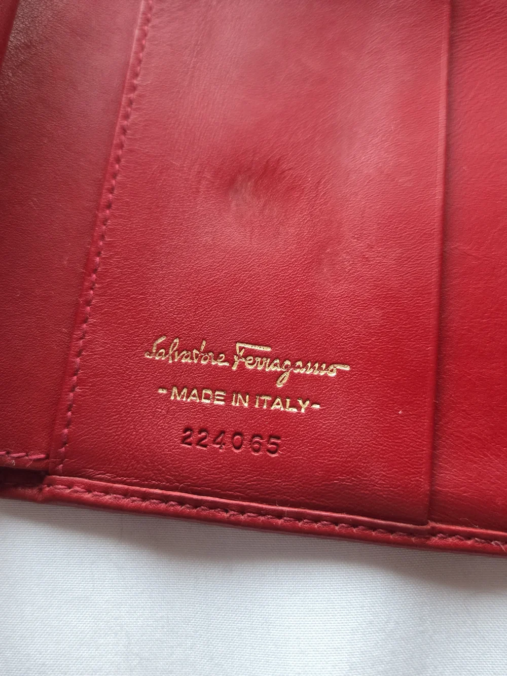 Red Leather Salvatore Ferragamo Wallet Featuring a Gold Gancini Clasp